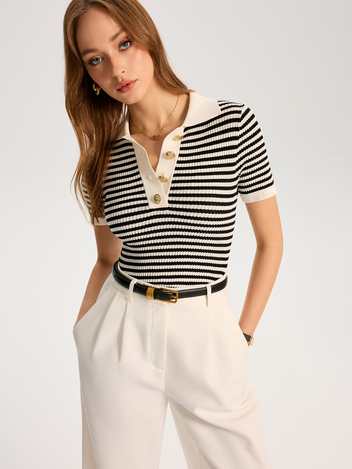 Polo en maille rayée à boutons métalliques