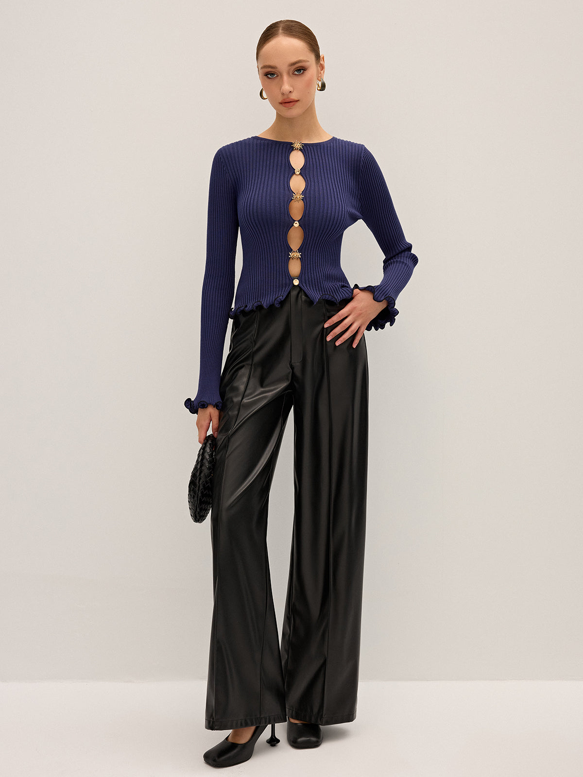 Haut en maille côtelée avec découpes et détails métalliques