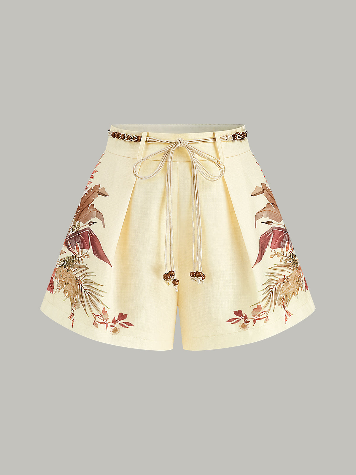 Shorts mit Gürtel und tropischem Muster, mittlere Bundhöhe