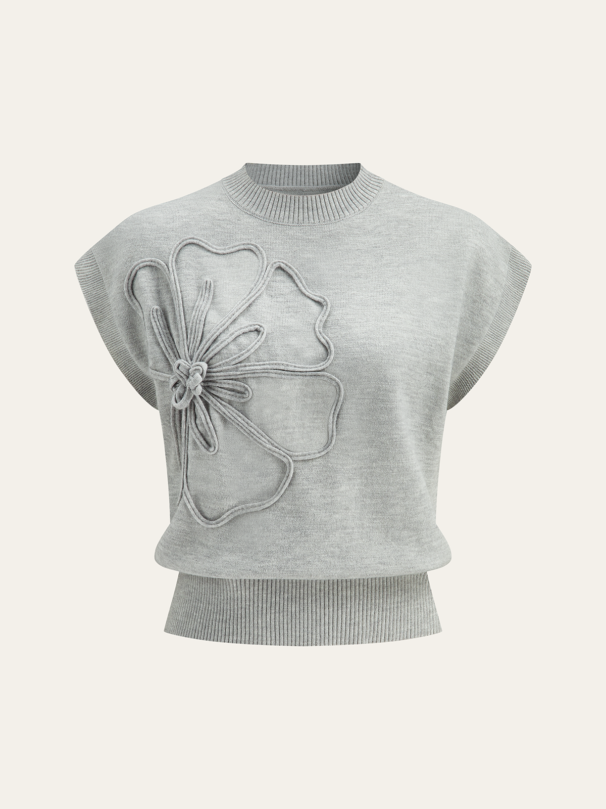Haut en maille à manches courtes et applique florale