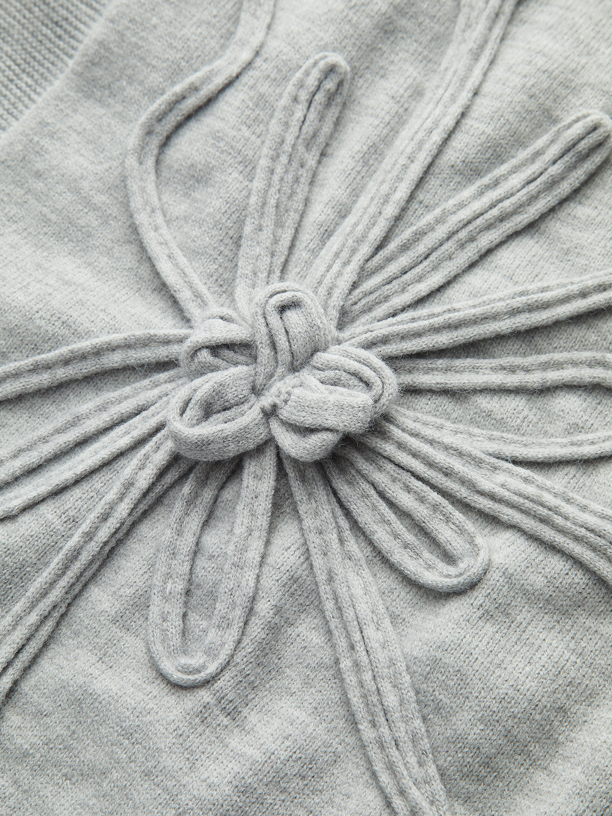 Haut en maille à manches courtes et applique florale