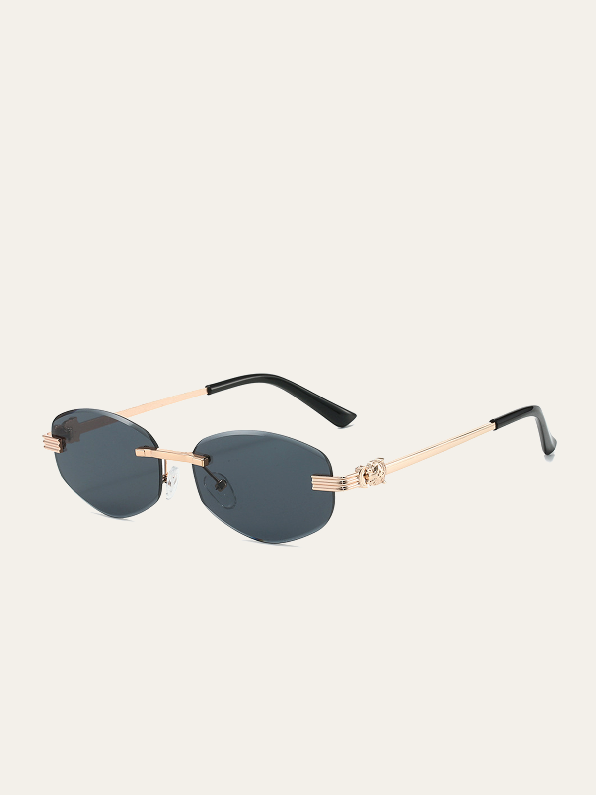 Lunettes de soleil ovales sans monture dorées