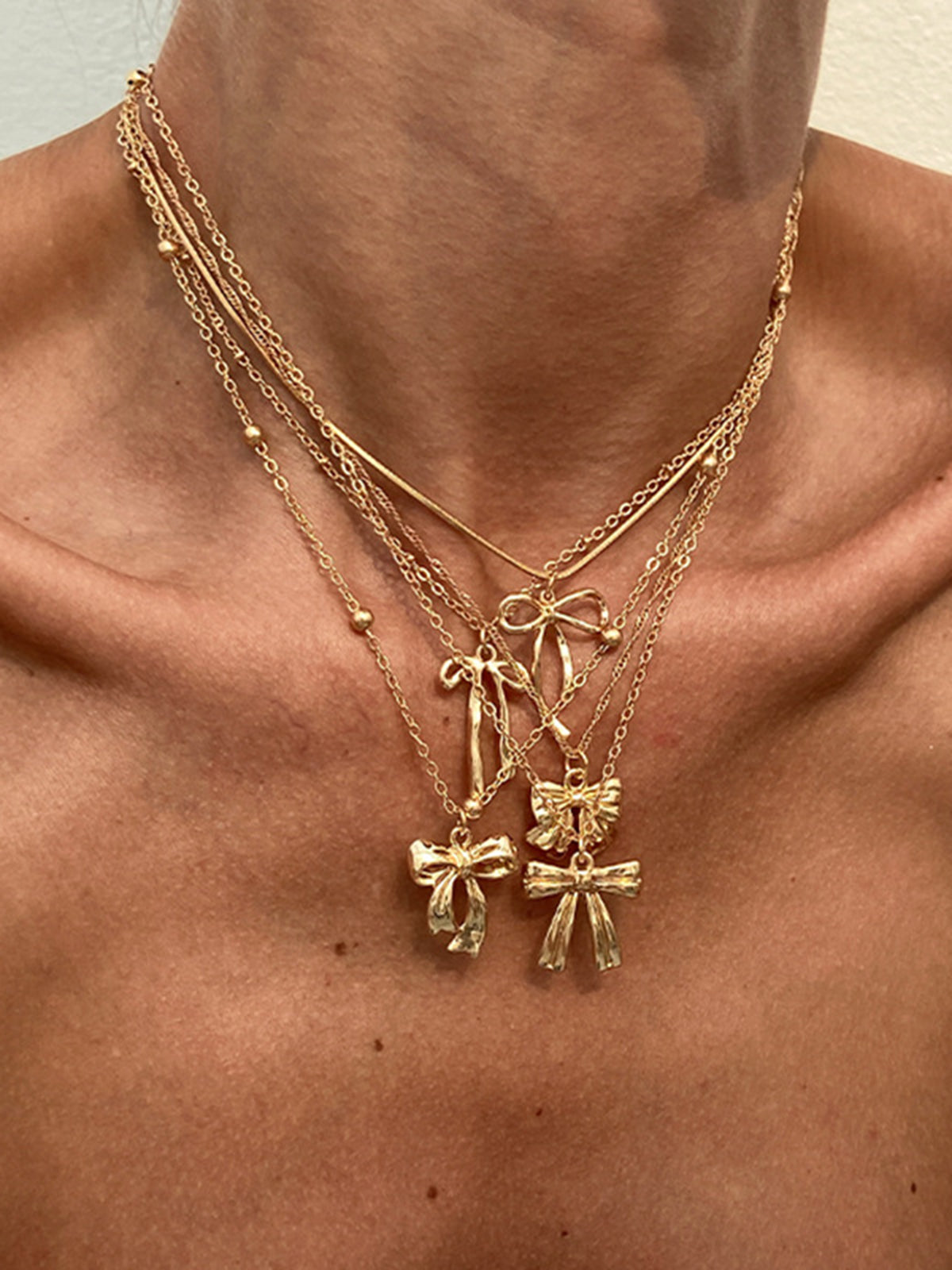 Ensemble de 5 colliers à breloque nœud