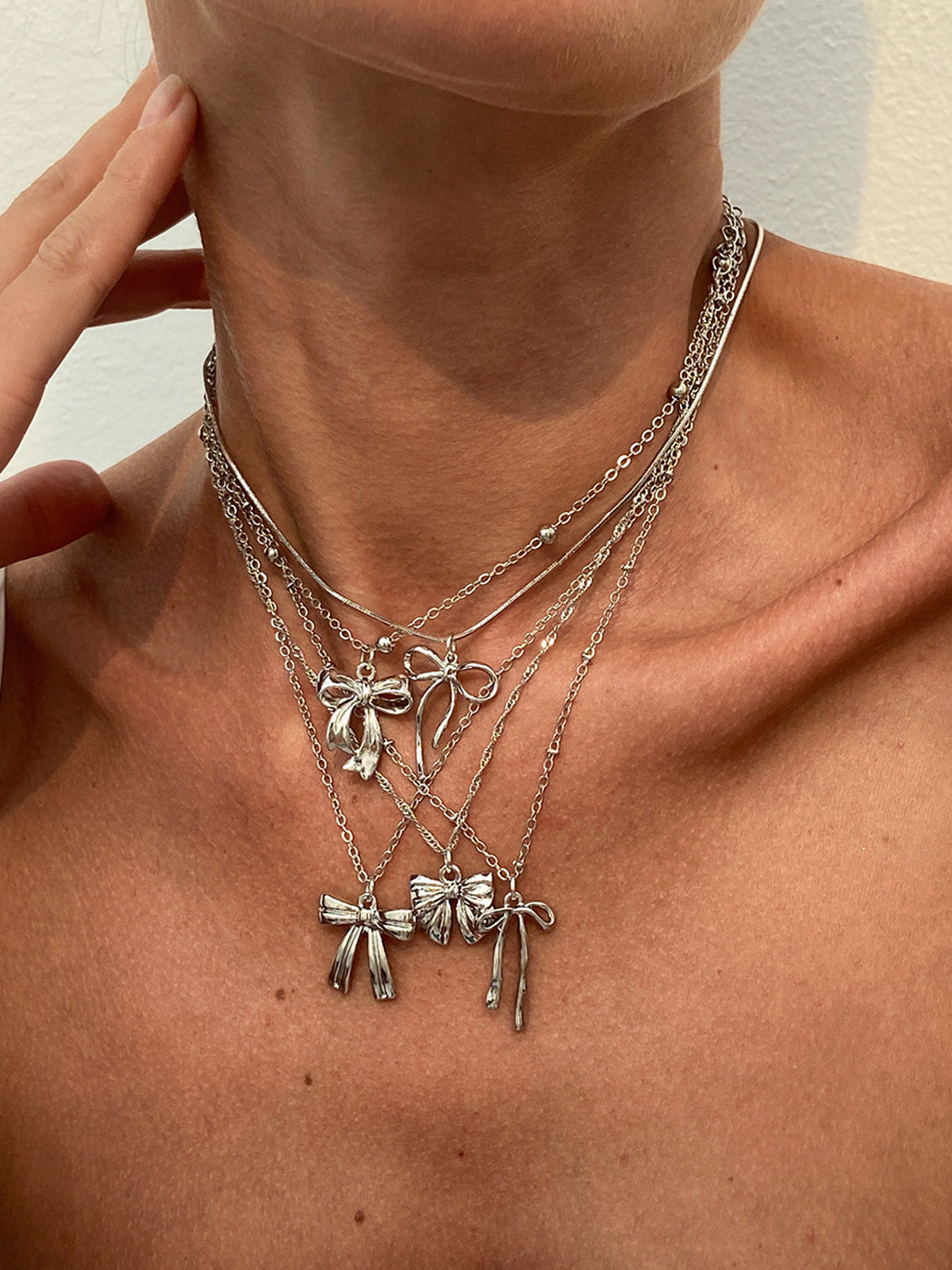 Ensemble de 5 colliers à breloque nœud