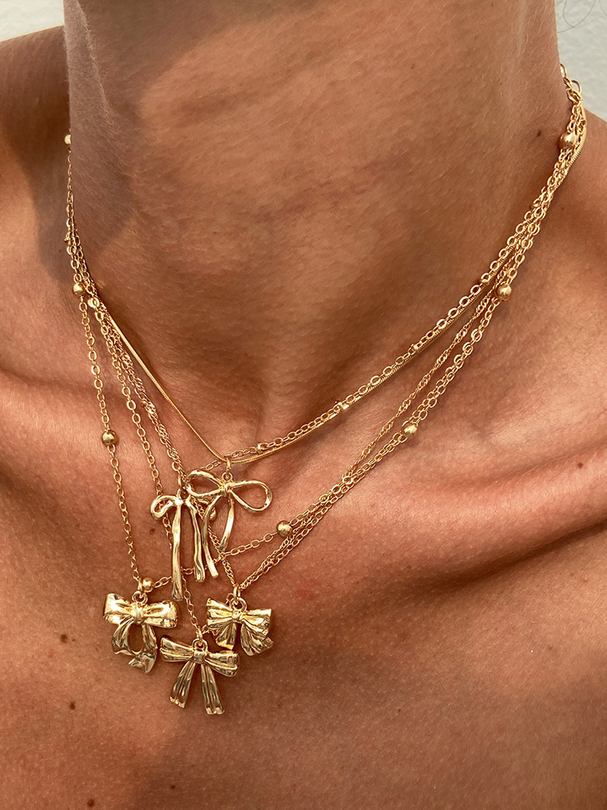 Ensemble de 5 colliers à breloque nœud