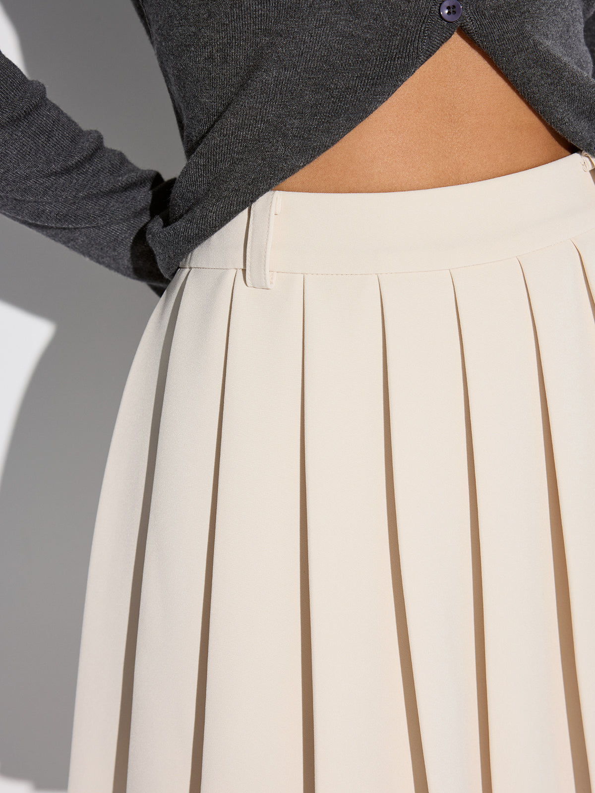 Mini-jupe plissée taille mi-haute