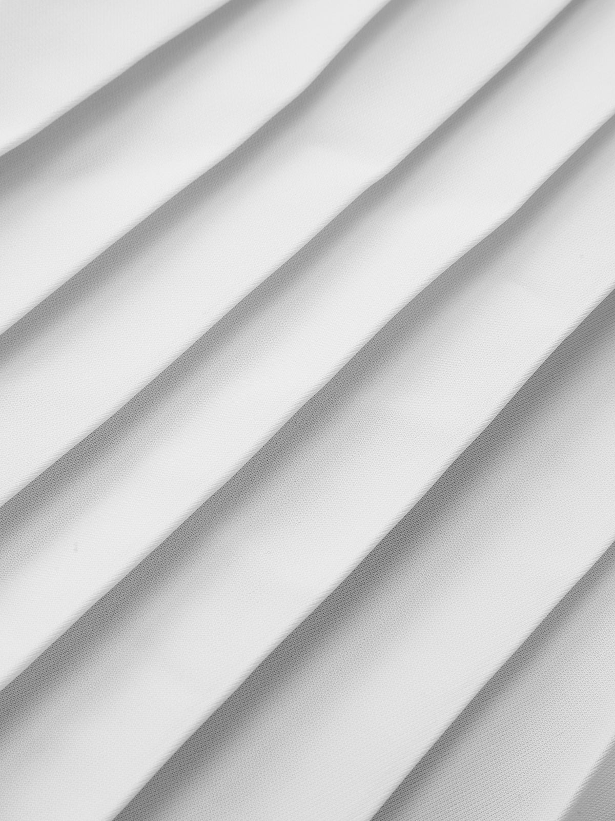 Minirock mit Farbblock-Falten, Ziertaschen