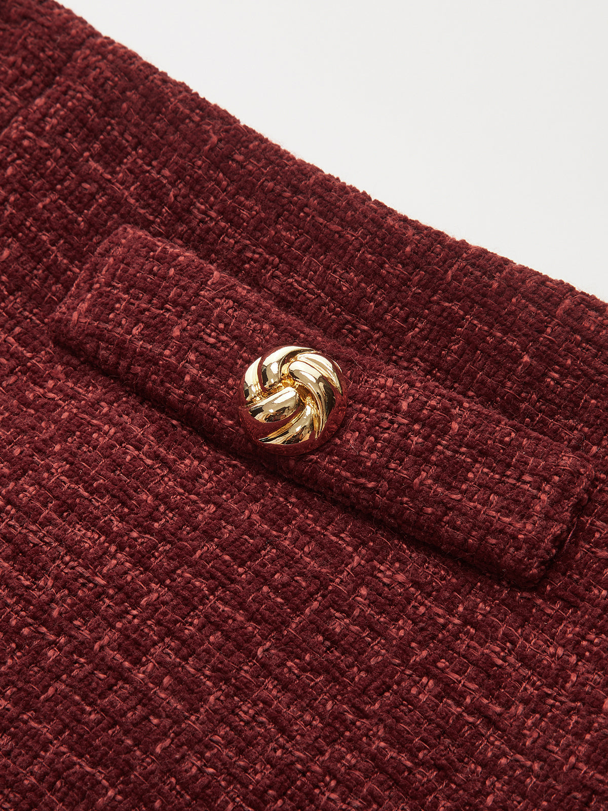 Minirock aus Tweed mit Metalldetails und Schlitz