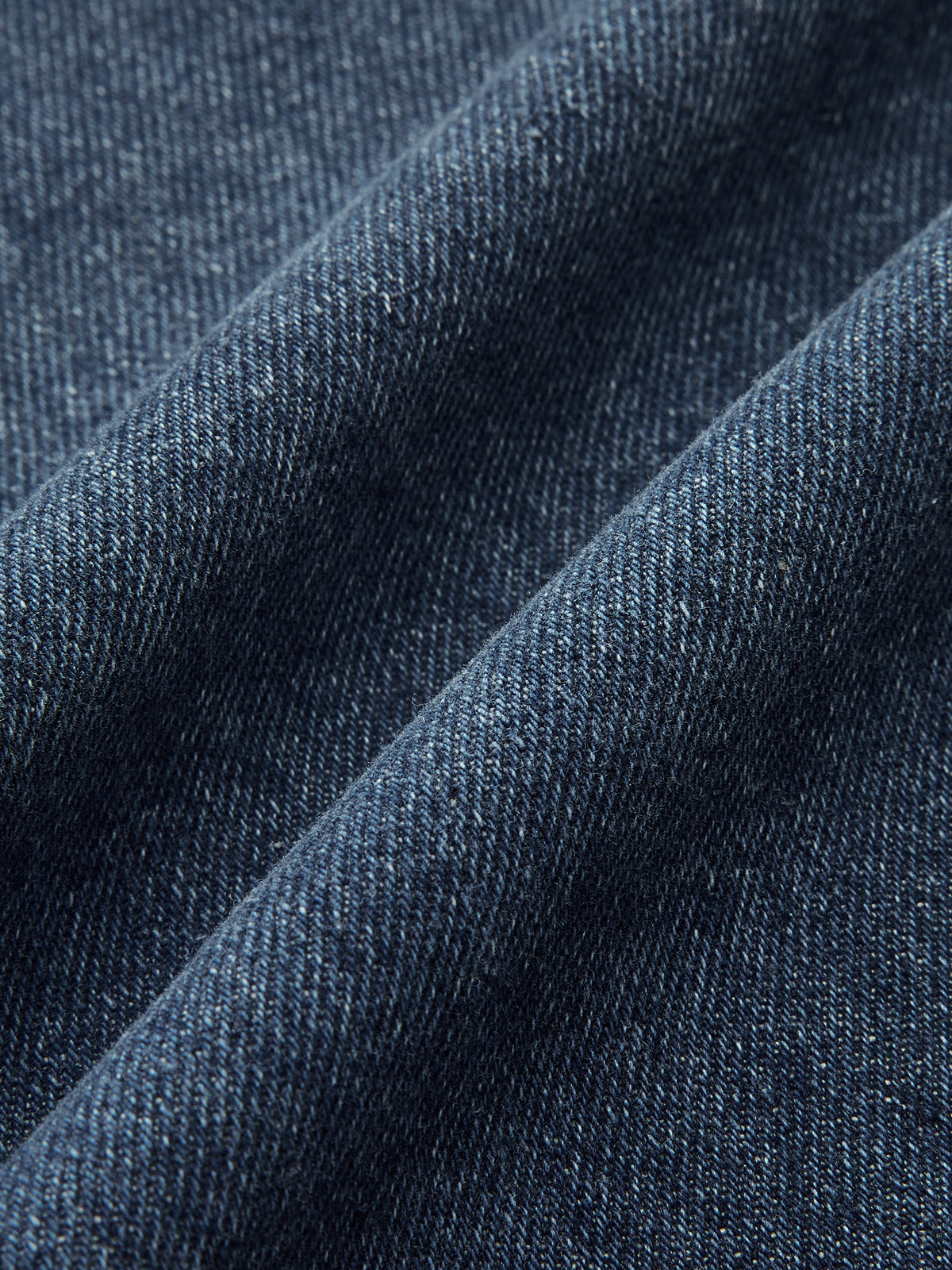 Pantalon en denim taille mi-haute à jambes incurvées