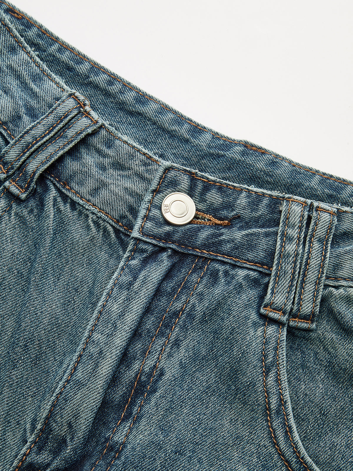 Jean taille haute à empiècements et ourlet effiloché