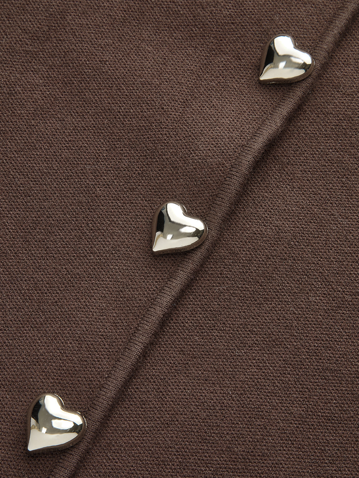 Gilet en tricot de laine mélangée à manches gigot et boutons cœurs