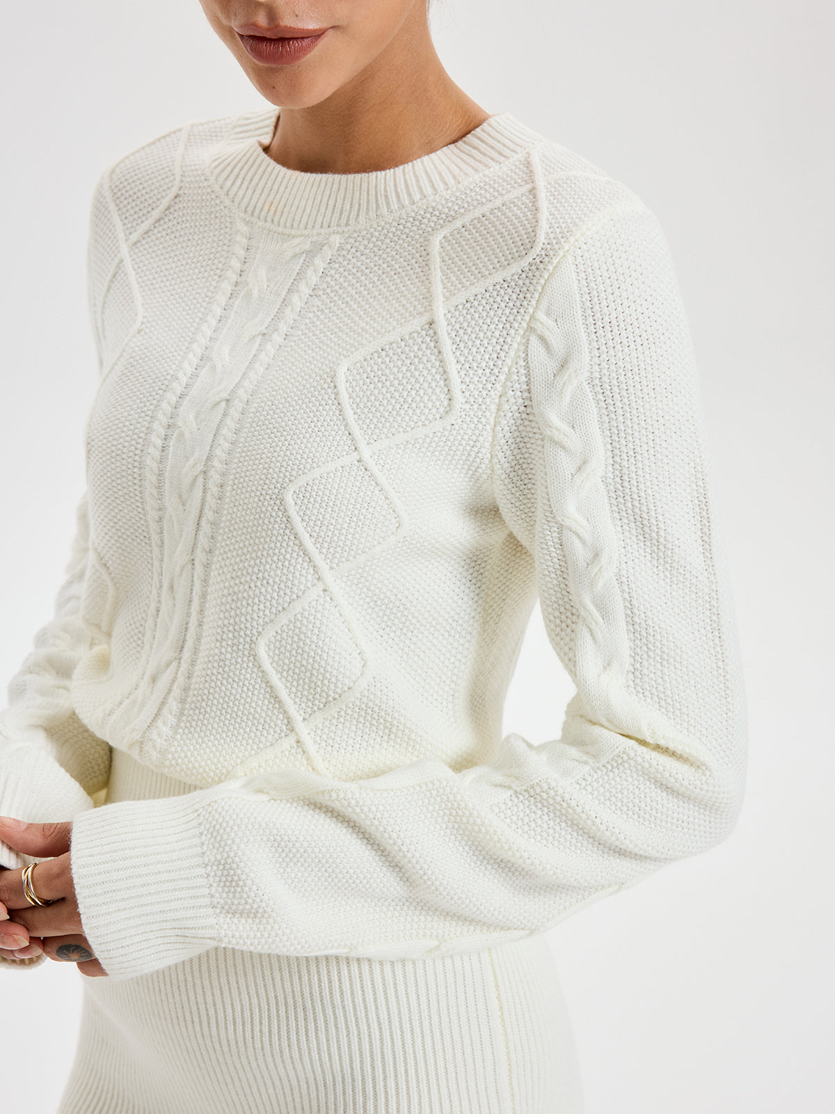Robe pull à col rond en maille torsadée
