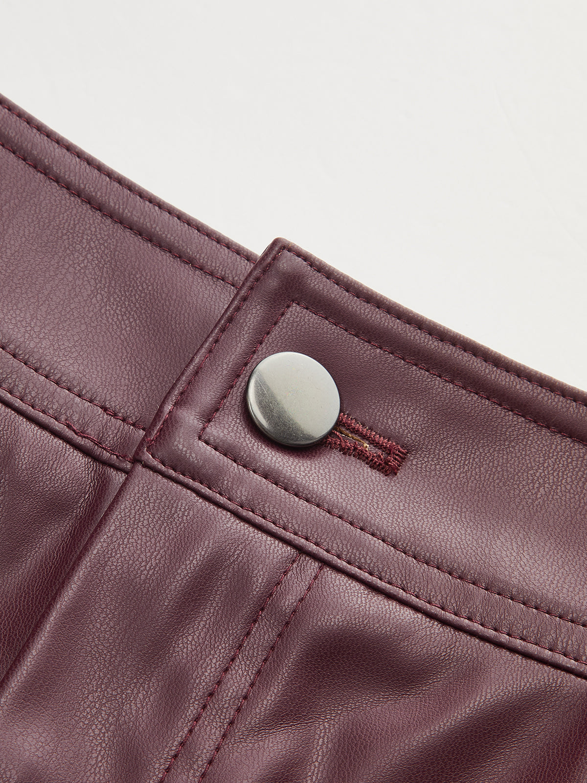 Mid-Waisted Faux Leather Curved-Leg Pants