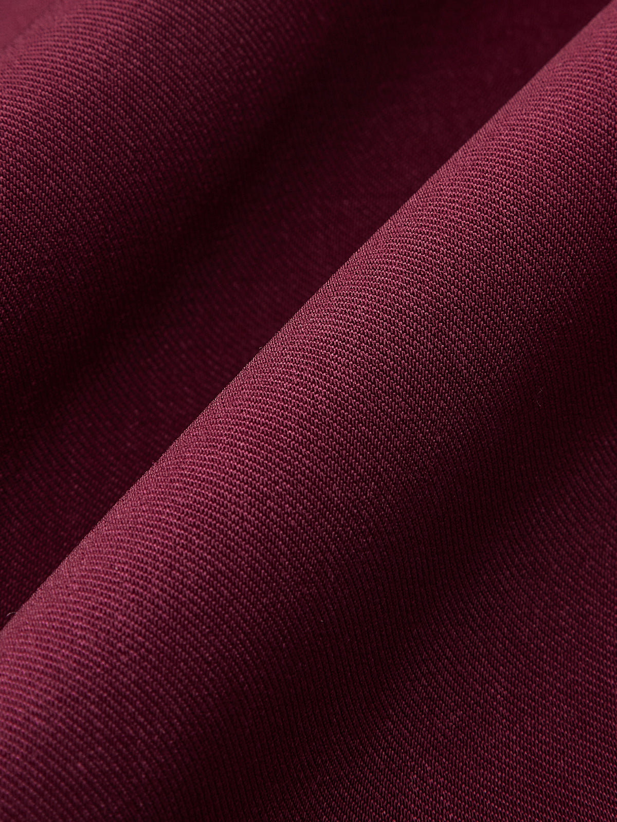 Pantalon large plissé taille haute à bouton métallique