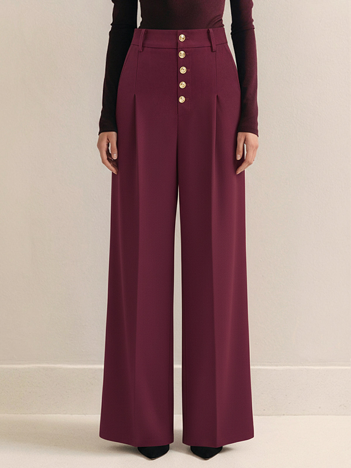Pantalon large plissé taille haute à bouton métallique