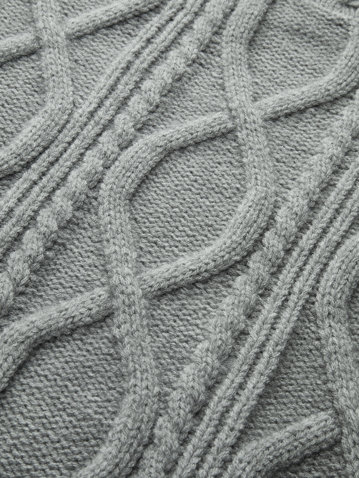 Pull à col montant en tricot torsadé