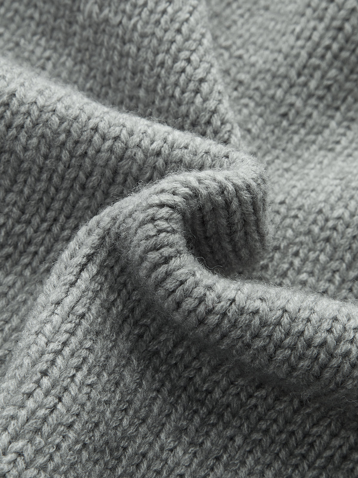 Pull à col montant en tricot torsadé