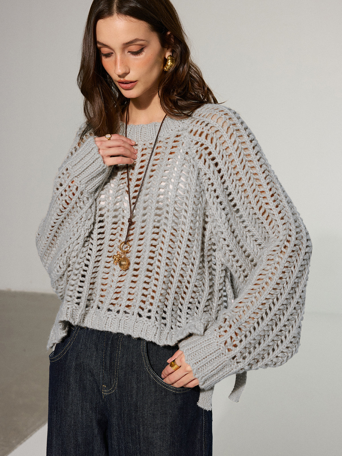 Pull oversize en maille ajourée à nouer sur le côté