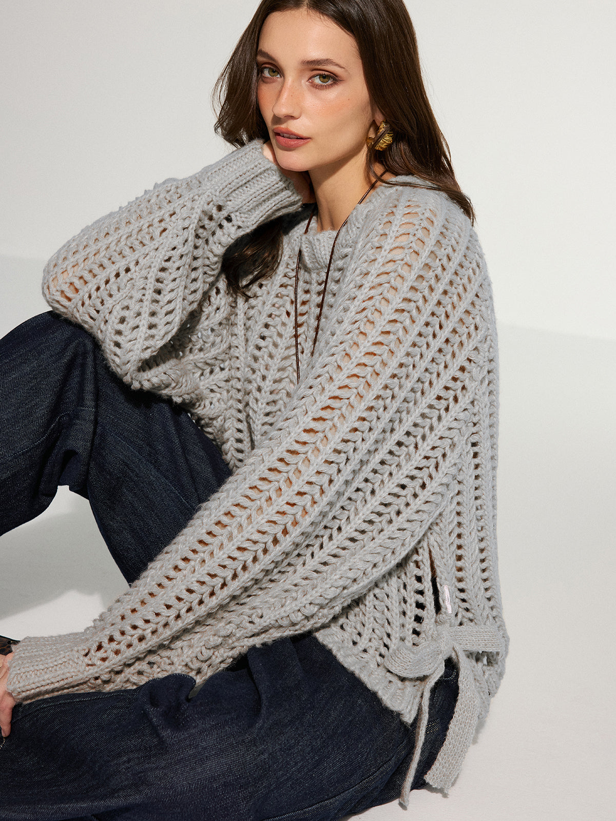 Pull oversize en maille ajourée à nouer sur le côté