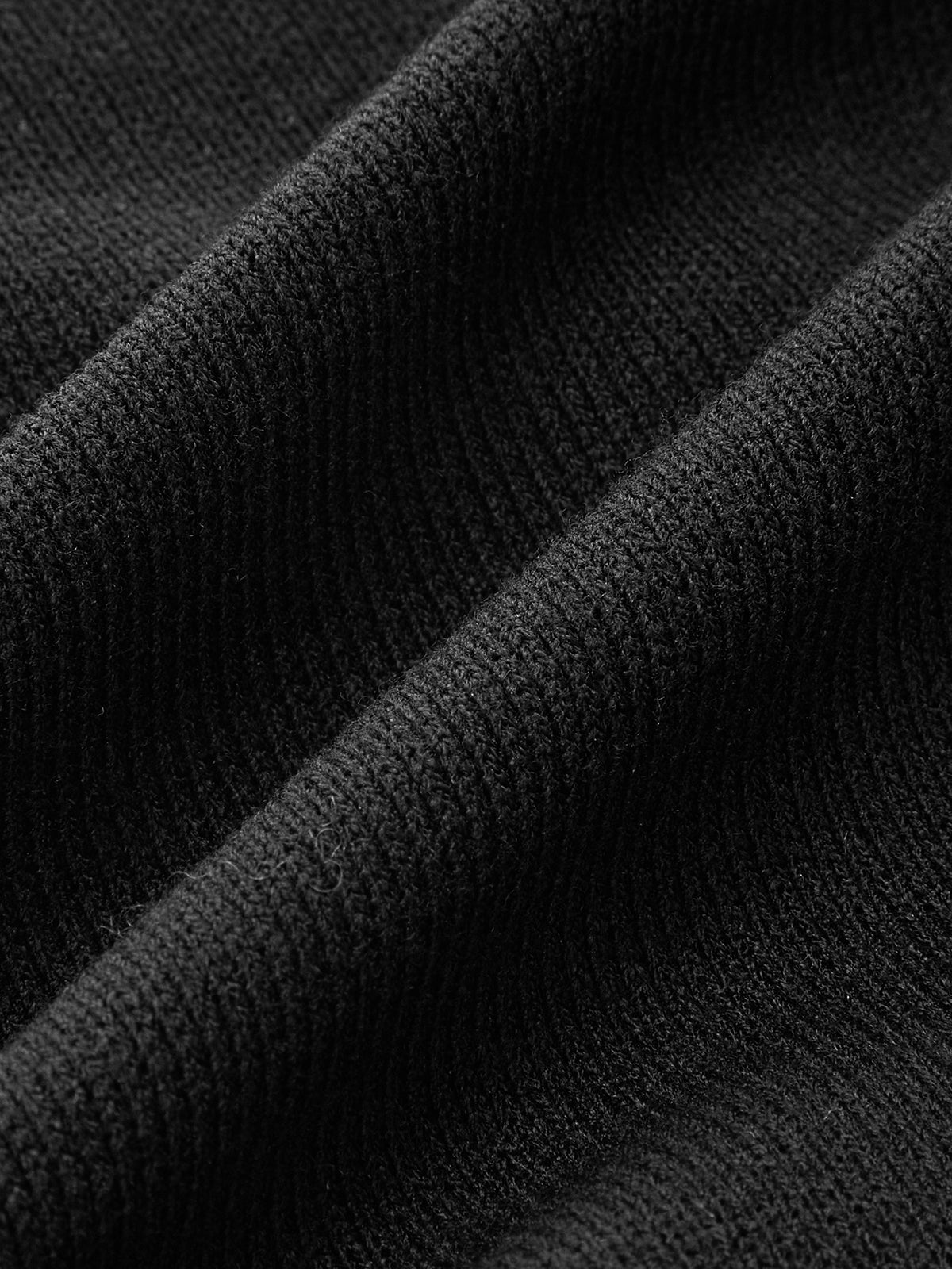 Haut en maille asymétrique avec empiècement en similicuir