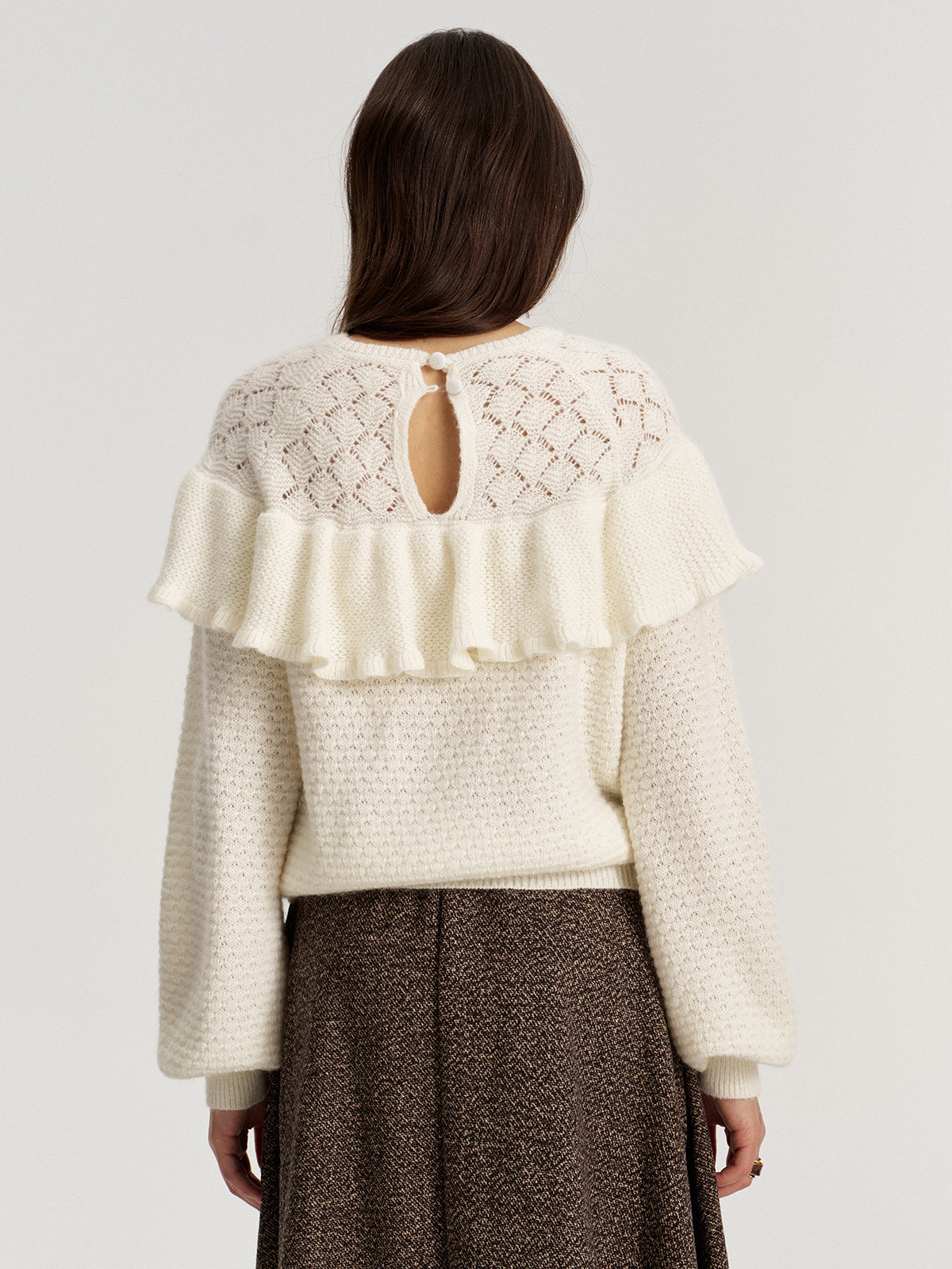 Oberteil aus Mohair-Woll-Mischung mit Rüschen und Pointelle-Strickmuster