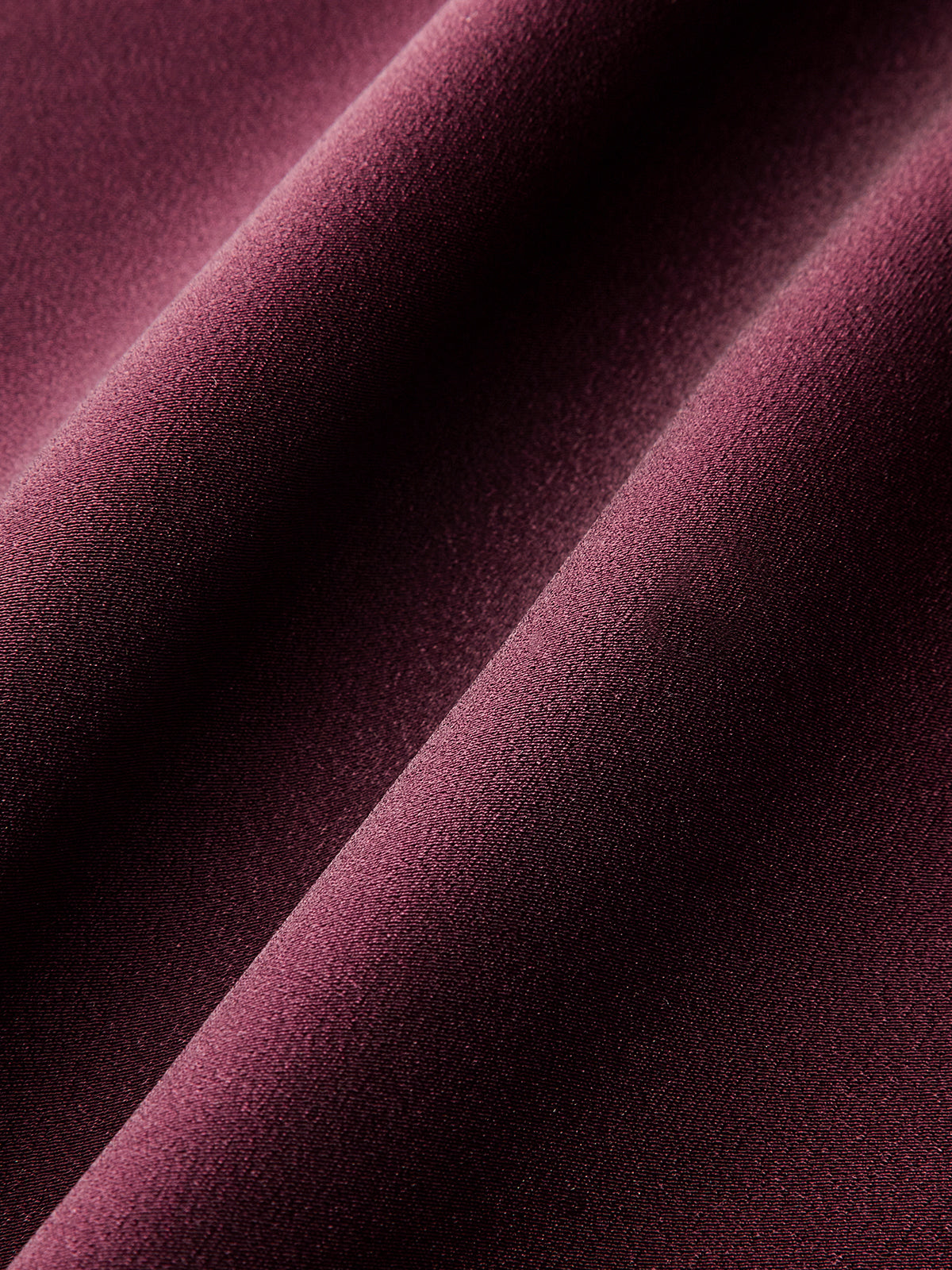 Combinaison en satin ceinturée à col en V
