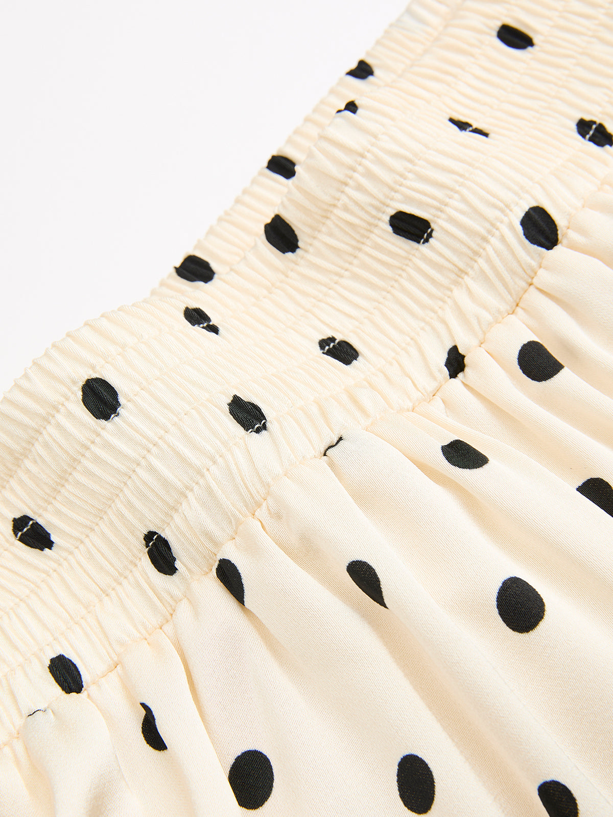 Ensemble haut sans manches et jupe longue à pois