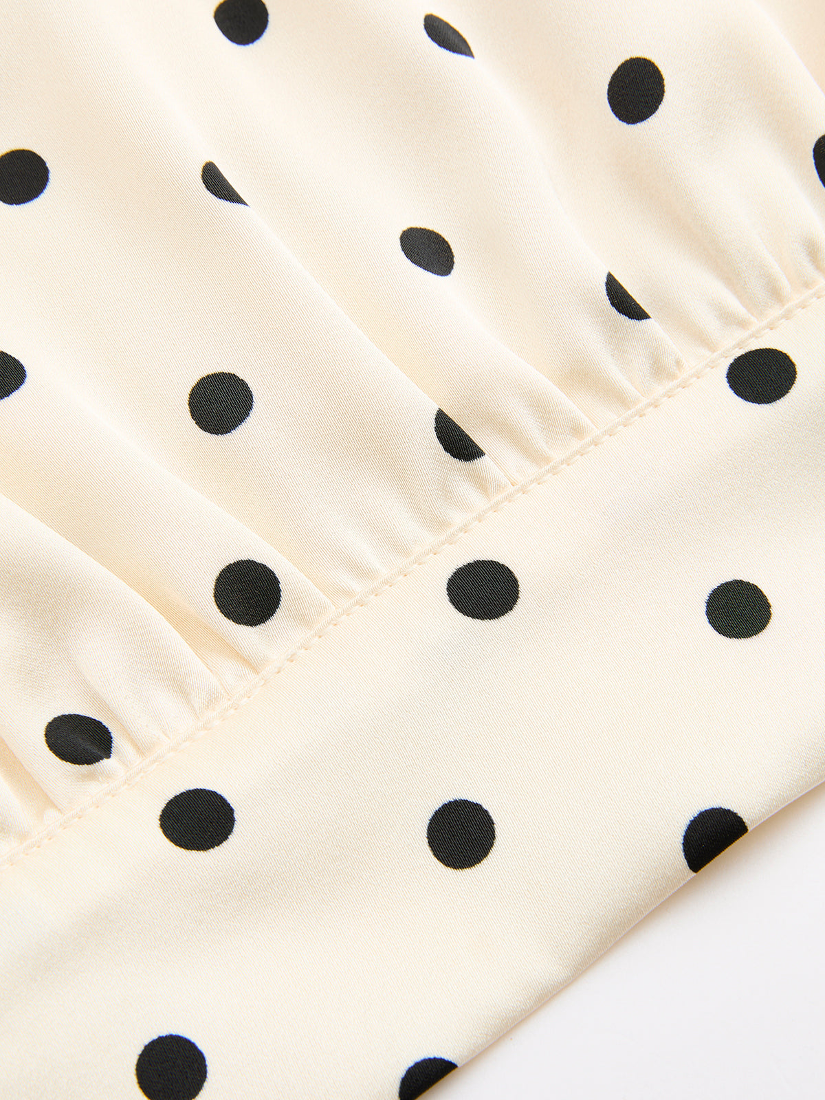 Ensemble haut sans manches et jupe longue à pois