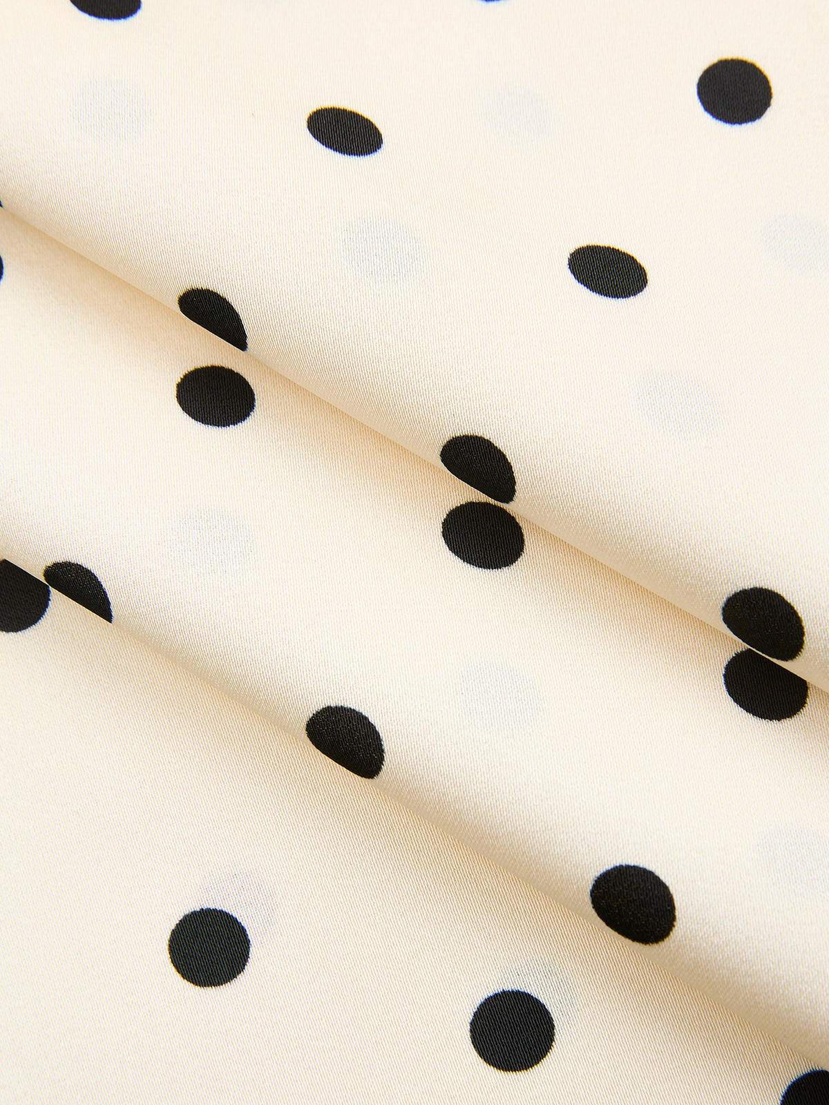 Ensemble haut sans manches et jupe longue à pois