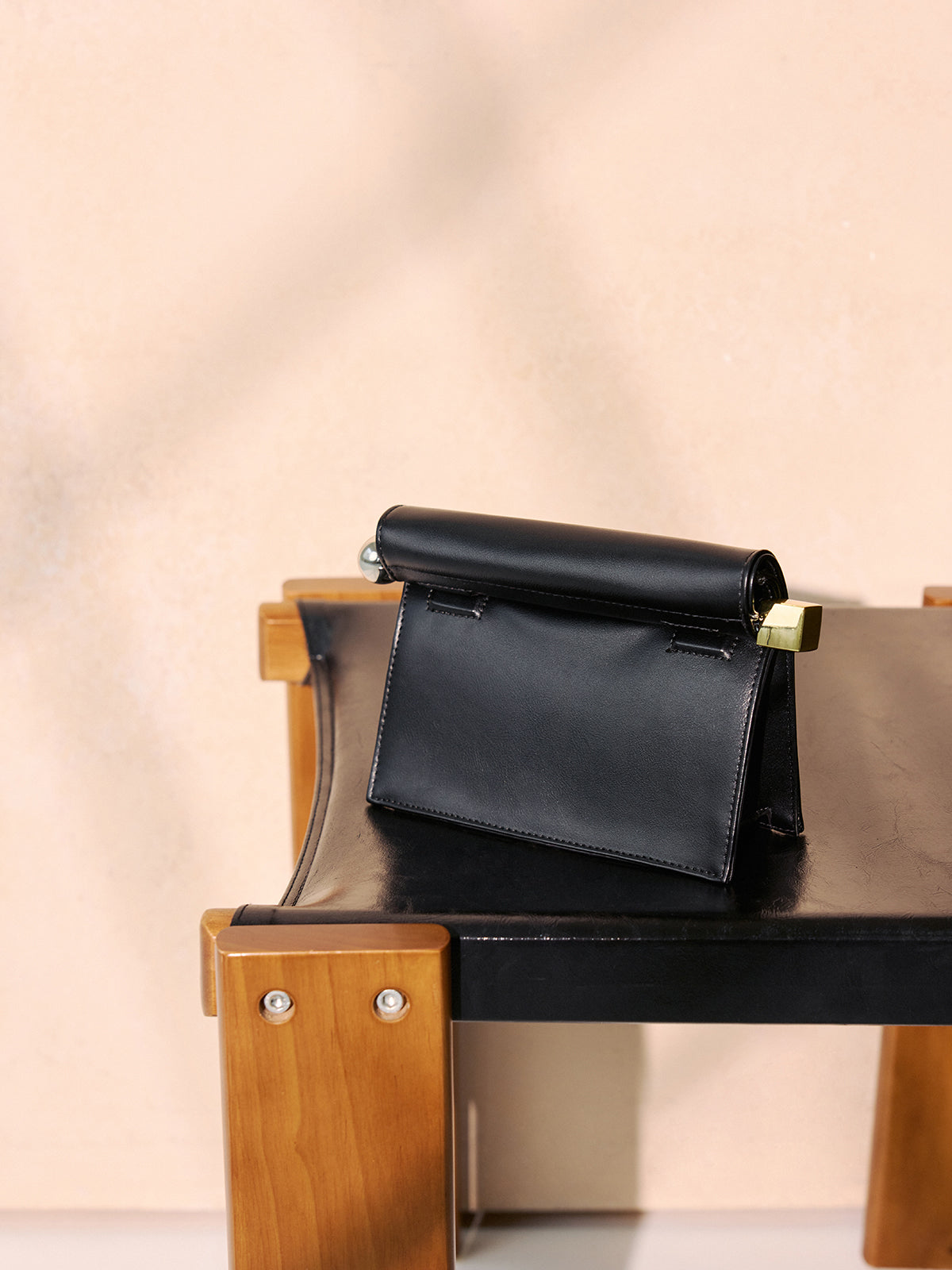 Metal Accent Roll-Top Clutch Bag