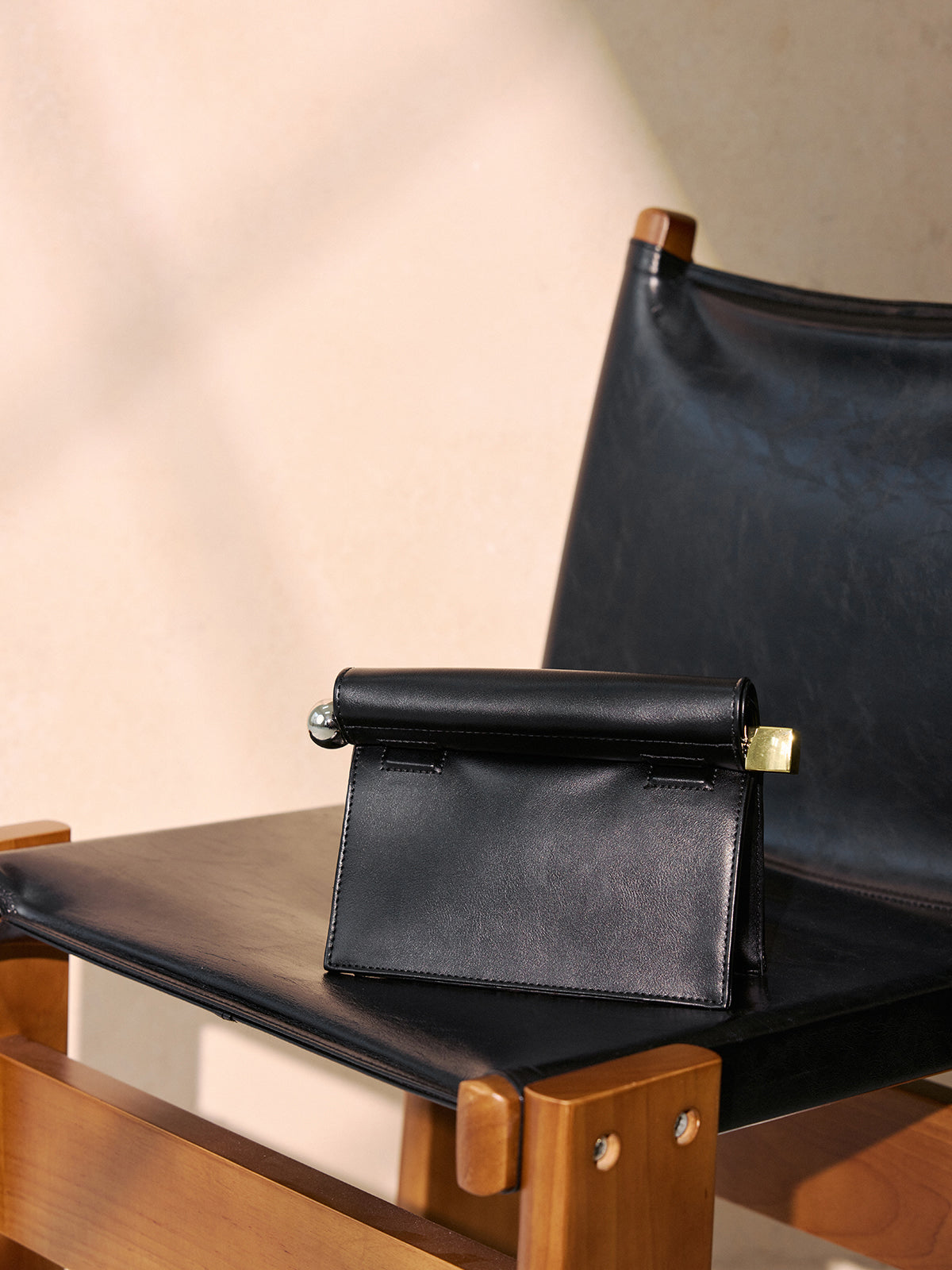 Metal Accent Roll-Top Clutch Bag