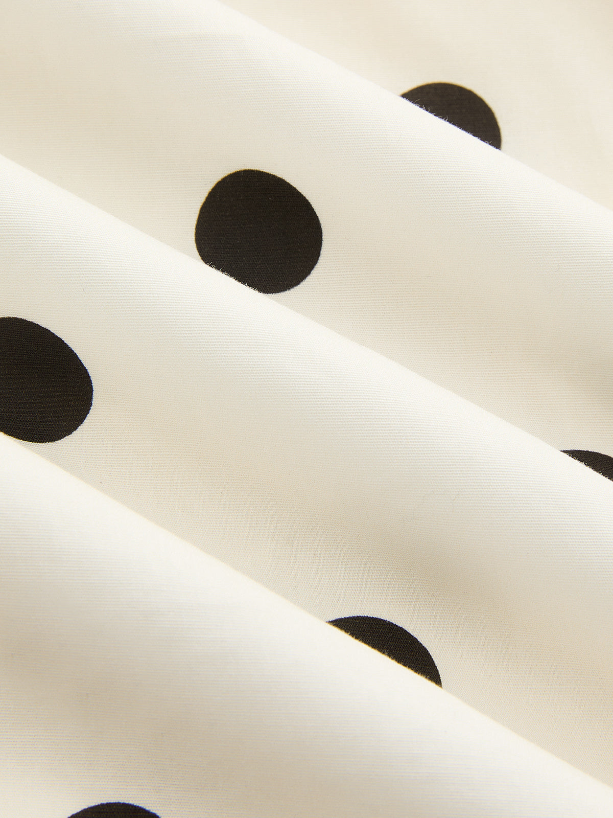 Robe longue à fines bretelles et fronces à pois