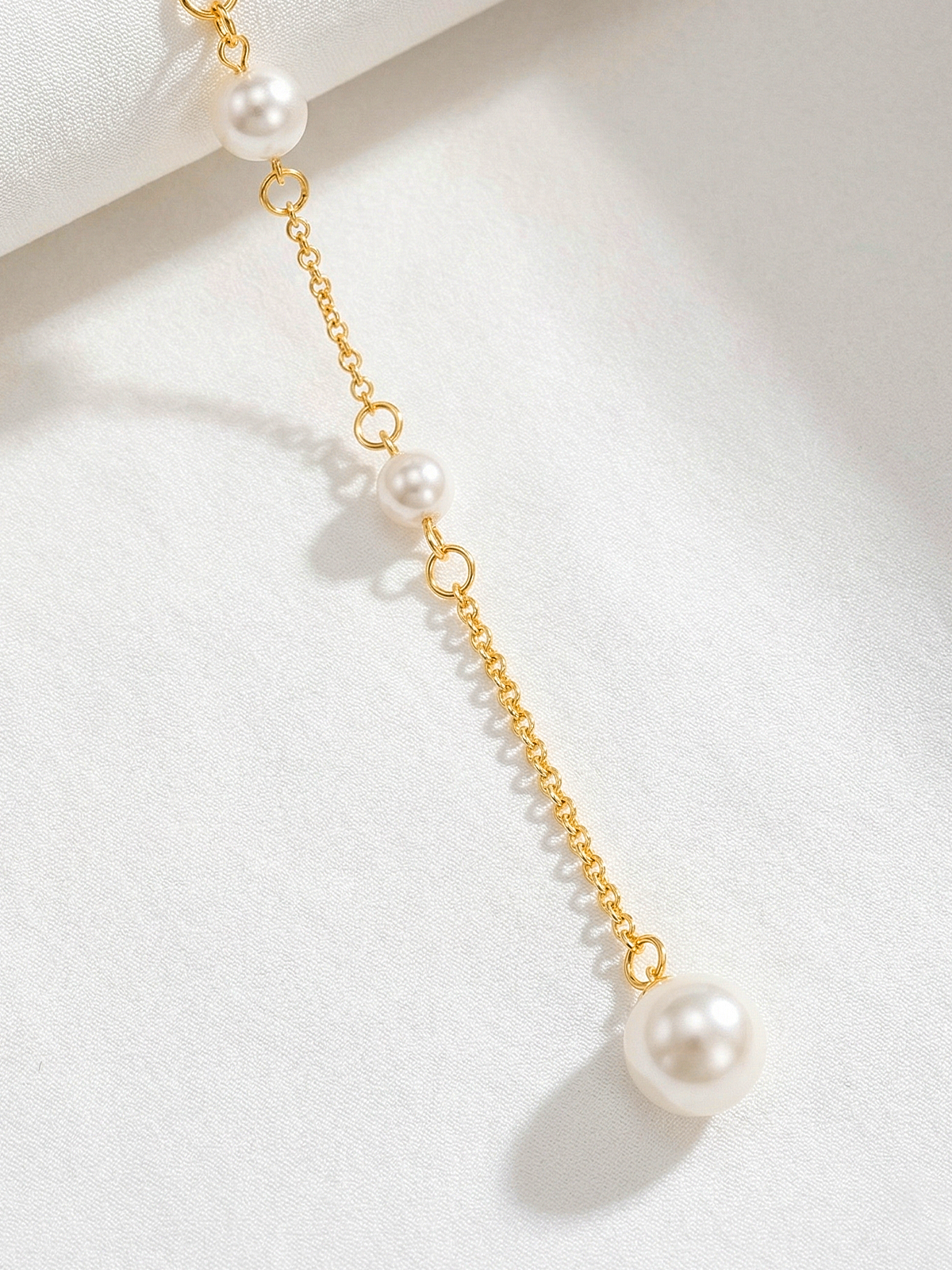 Long collier de dos avec perles