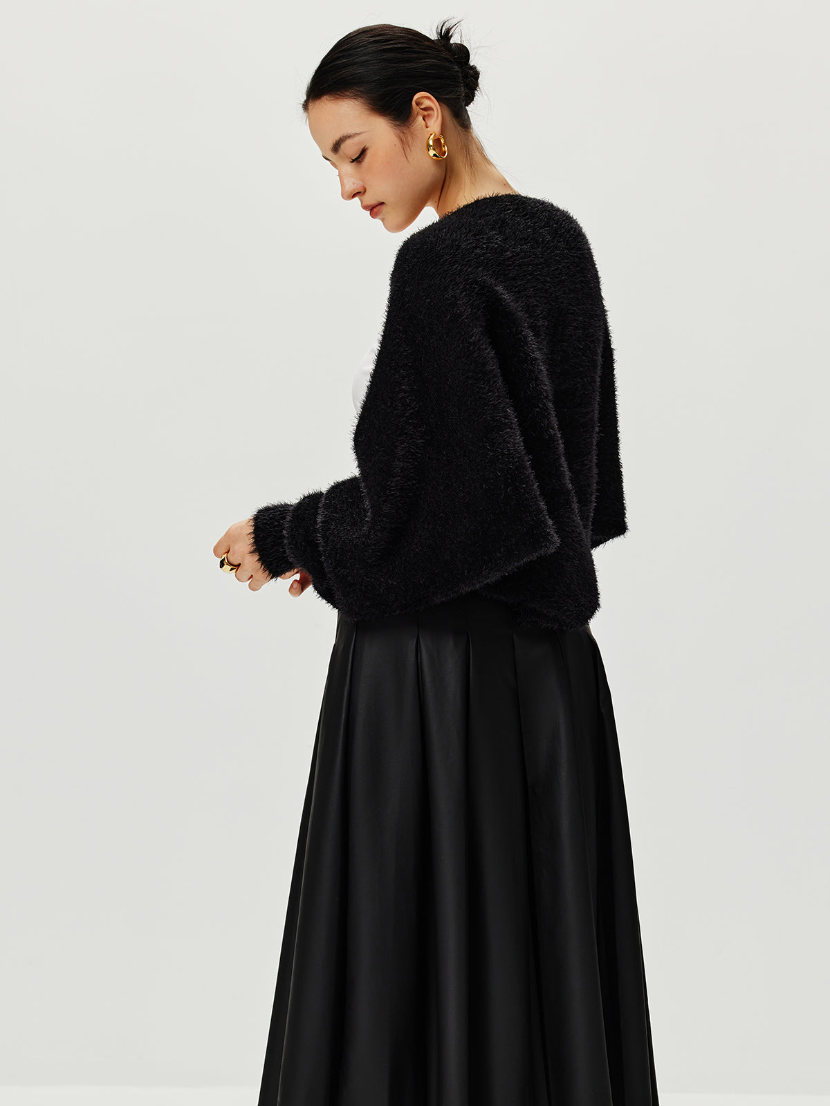 Haussement d'épaules Caïdigan duveteux