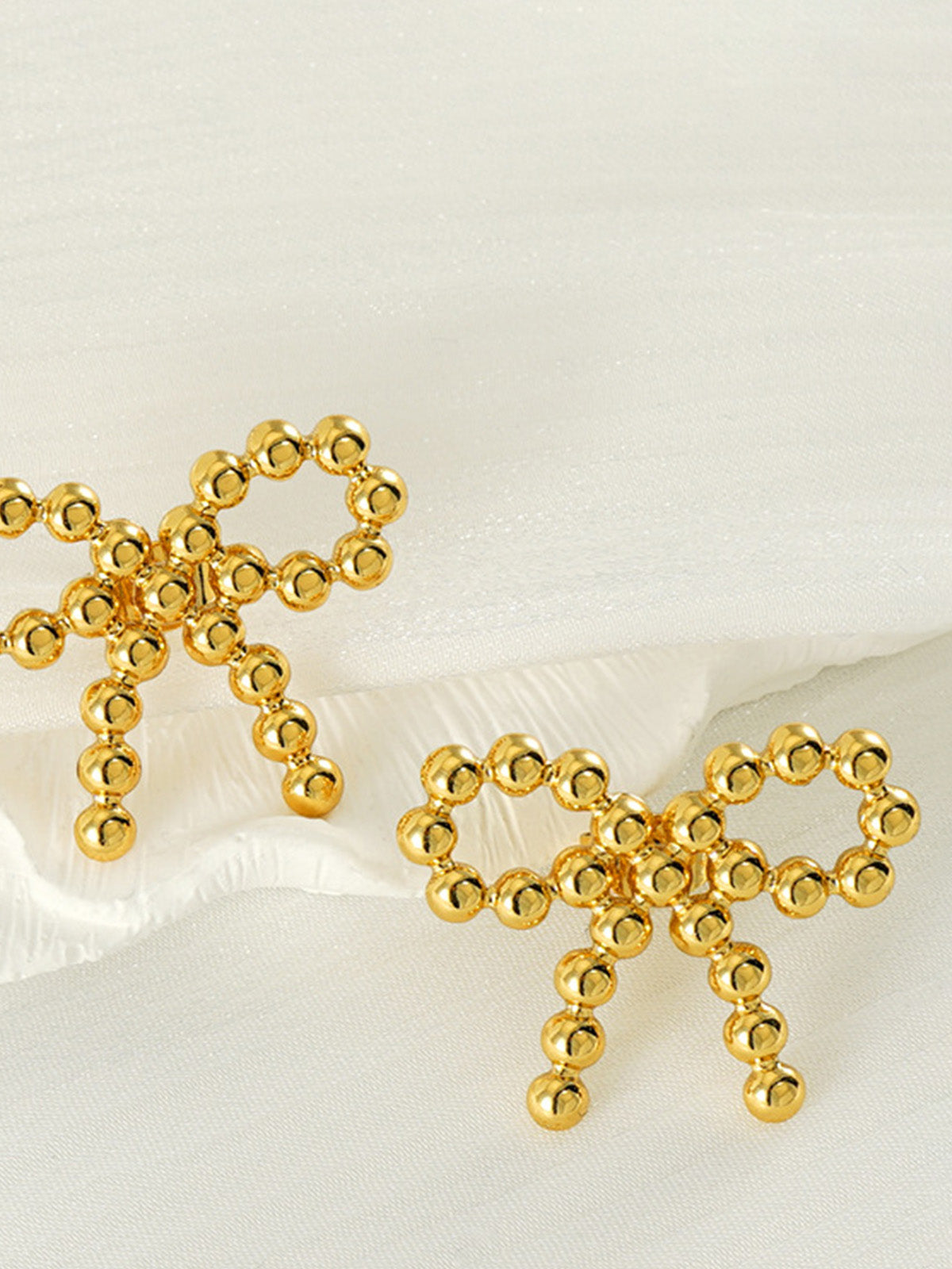 Perlenohrringe mit Schleife 