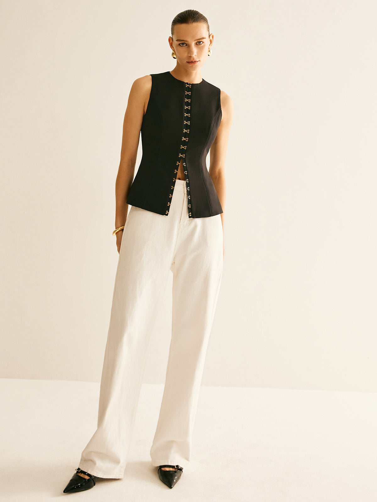 Gilet à col rond et détails métalliques 