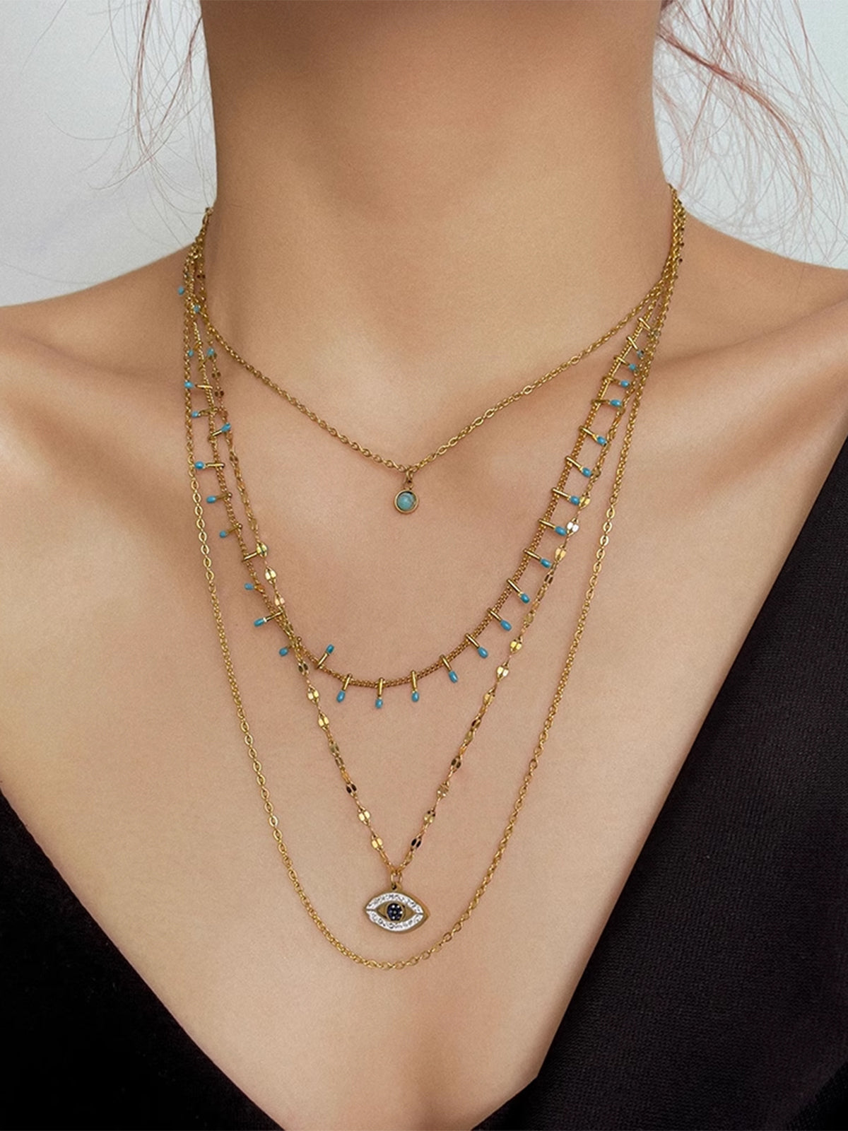 Collier pendentif œil maléfique en strass multicouches 