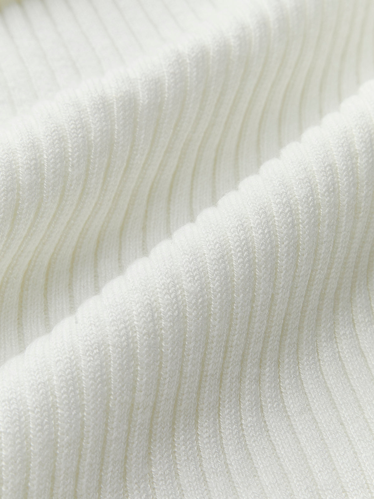 Haut asymétrique à col rond côtelé en maille 