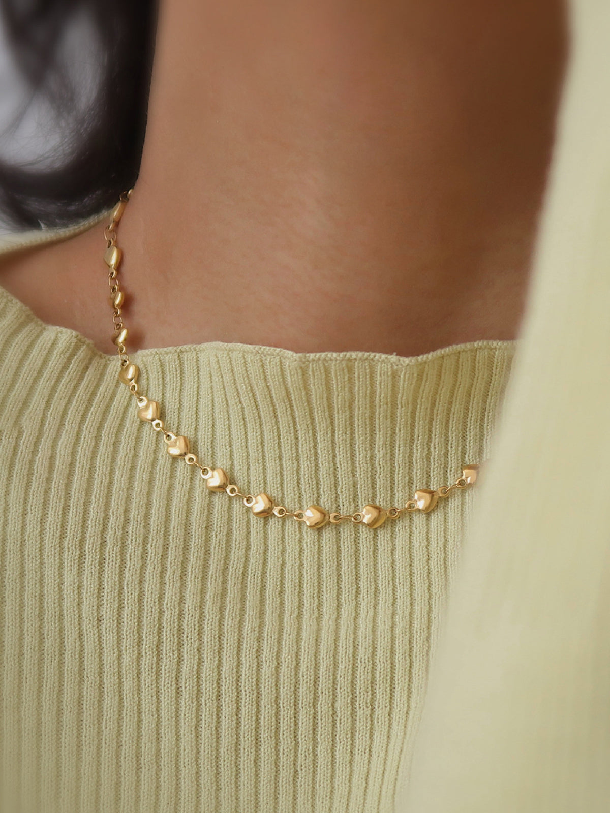 Collier à pompon en forme de cœur 