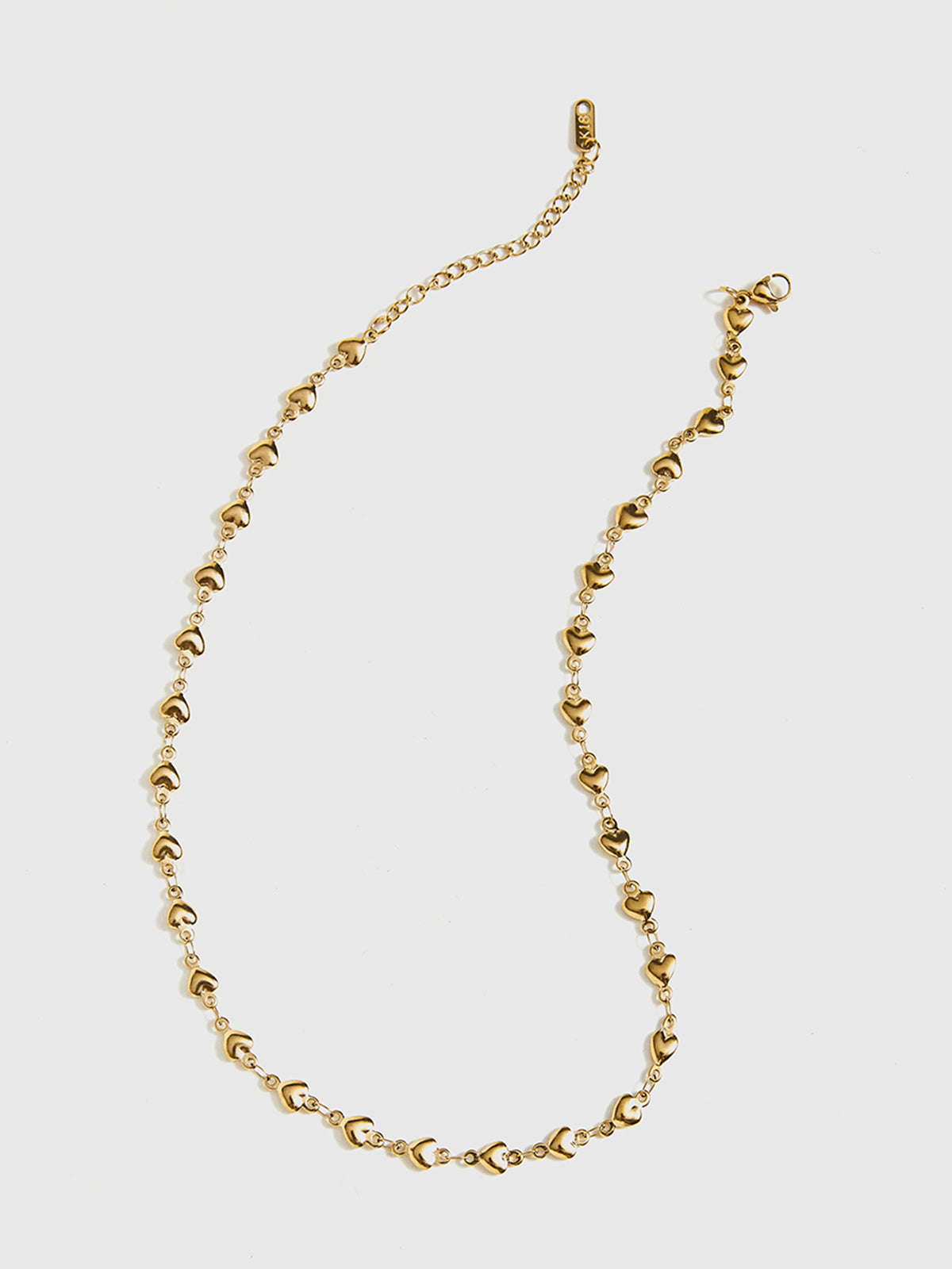 Collier à pompon en forme de cœur 