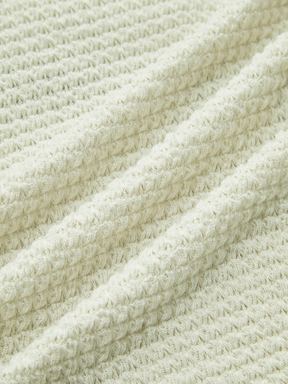 Pull slim uni en maille gaufrée 