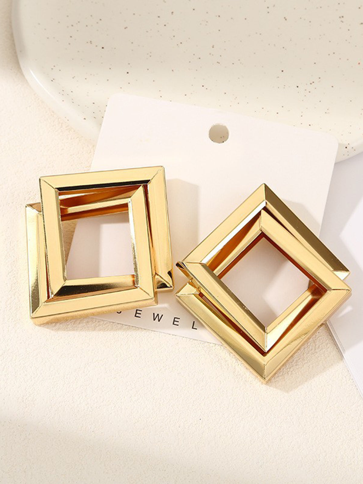 Boucles d'oreilles croix losanges en métal 