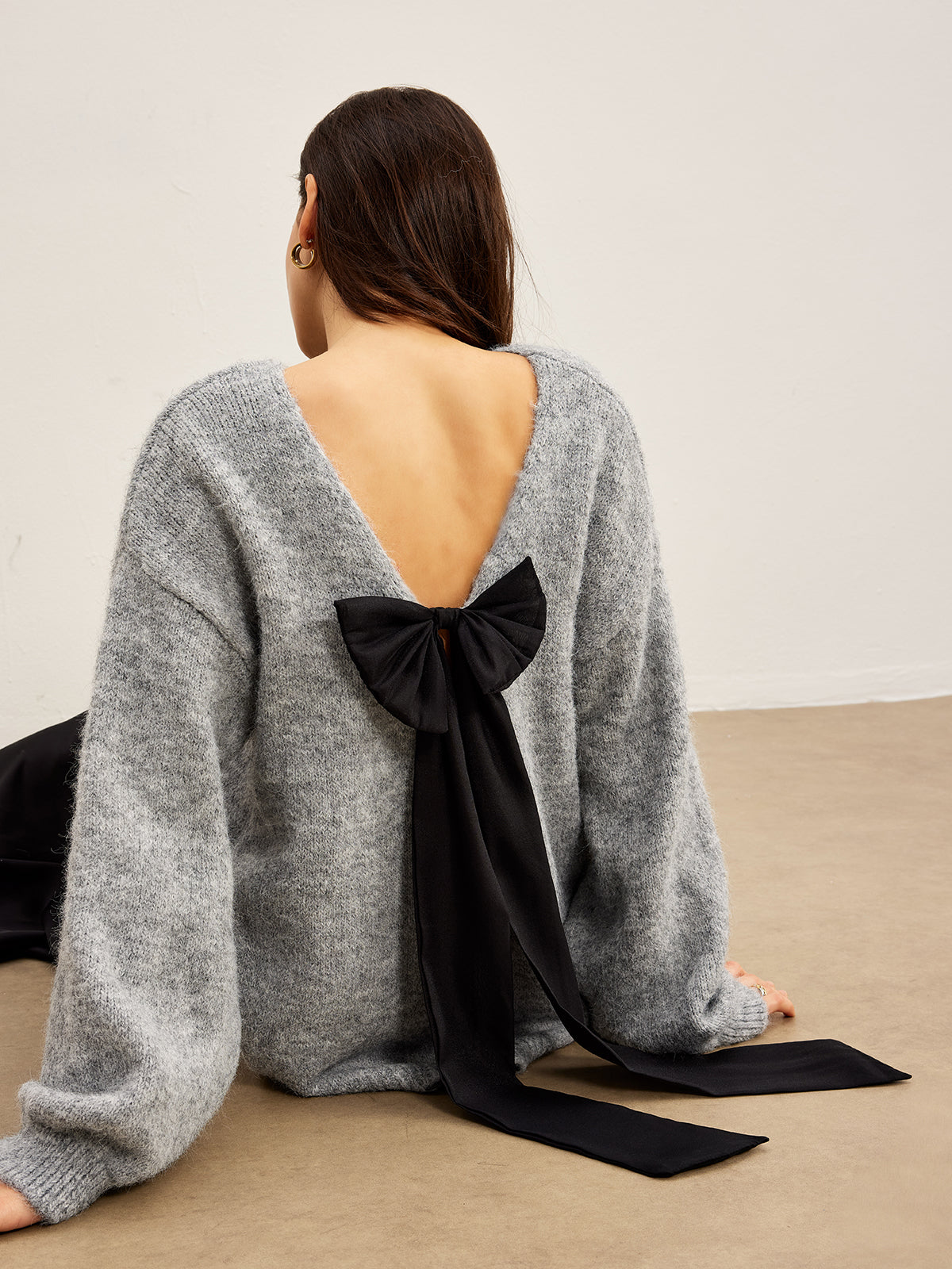 Pull dos nu à nœud papillon 