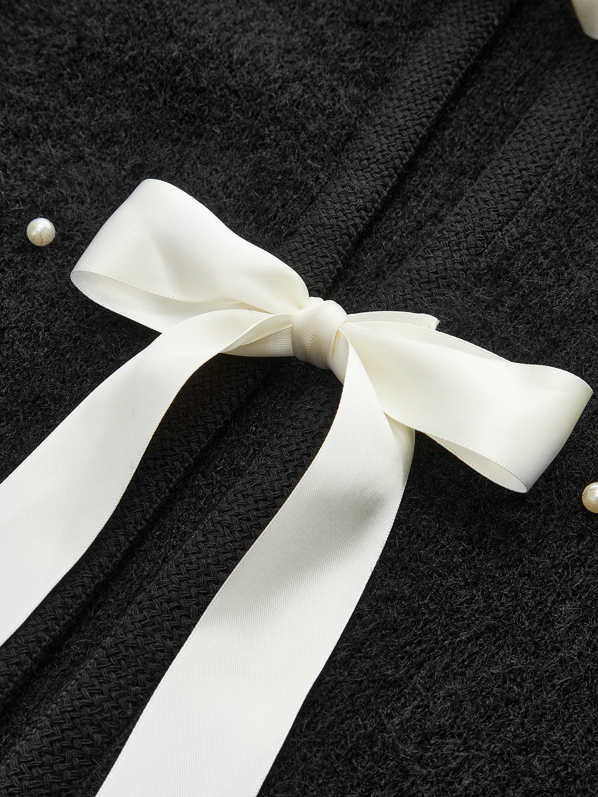 Haut en maille à nœud décoratif perlé 