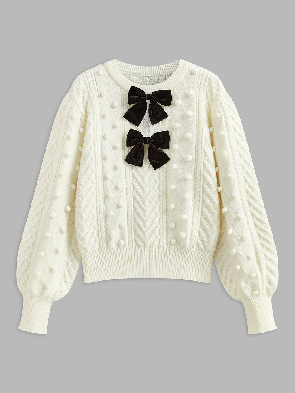 Strickpullover mit Schleife und Bommeln