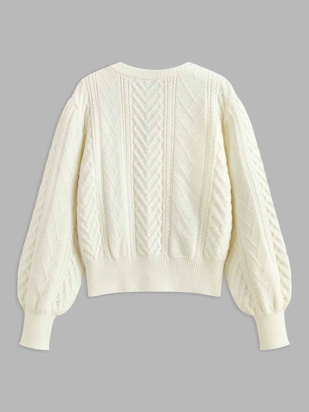 Strickpullover mit Schleife und Bommeln