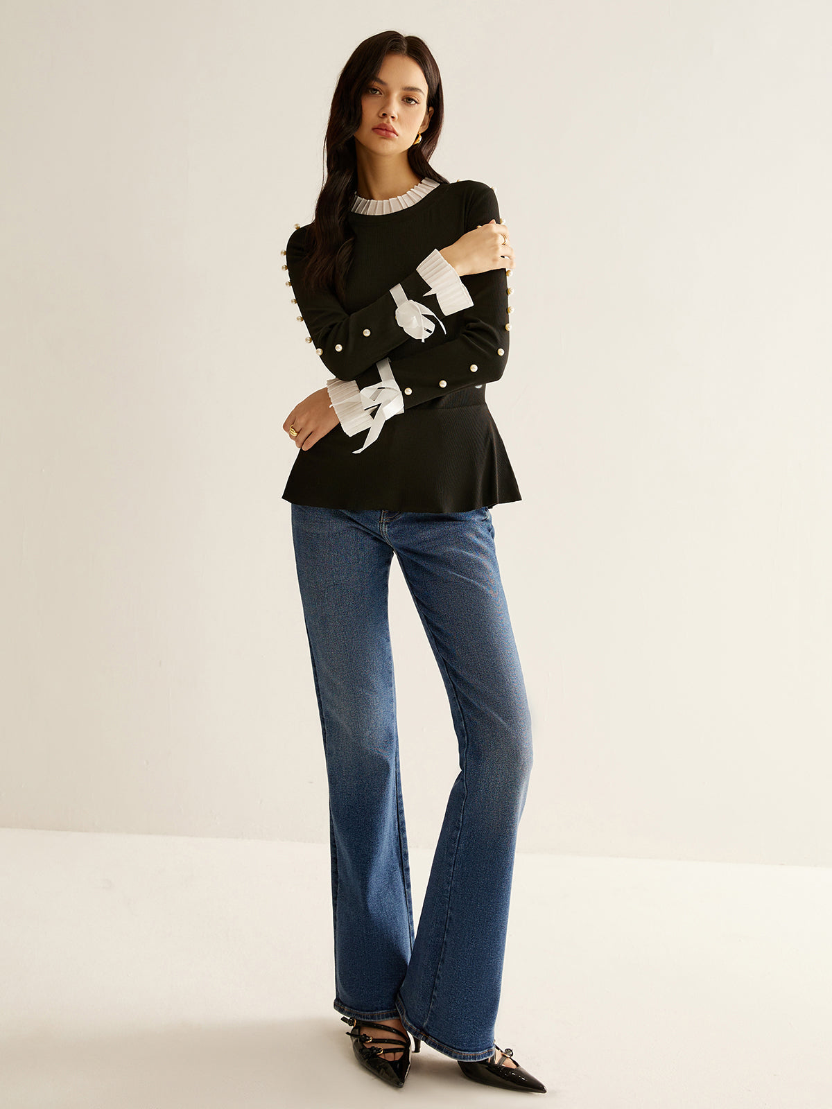 Blouse plissée à empiècements ornés de perles 