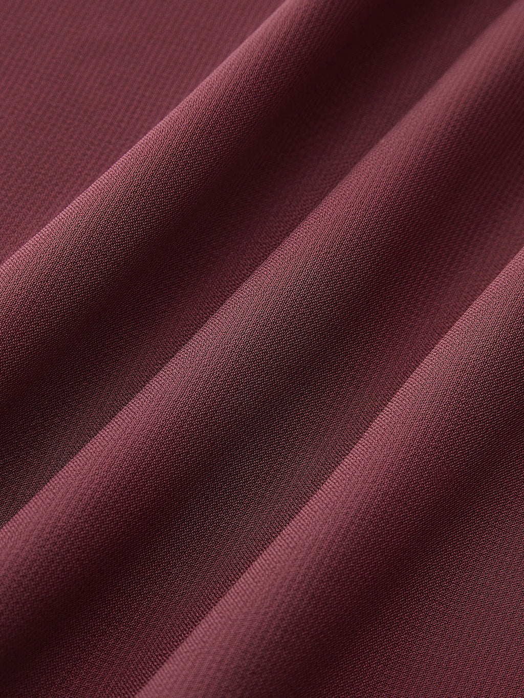Chemise en mousseline de soie à col montant et dos nu avec nœud