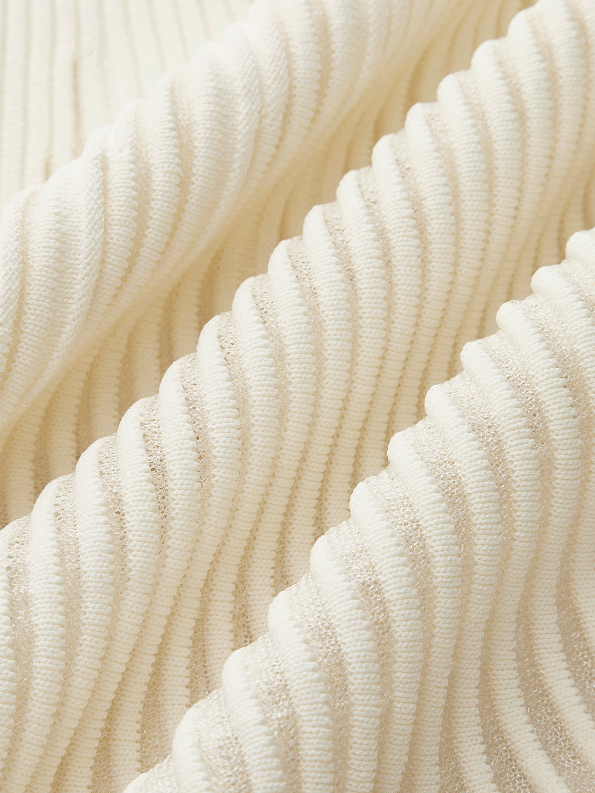 Jupe plissée à empiècements en résille 