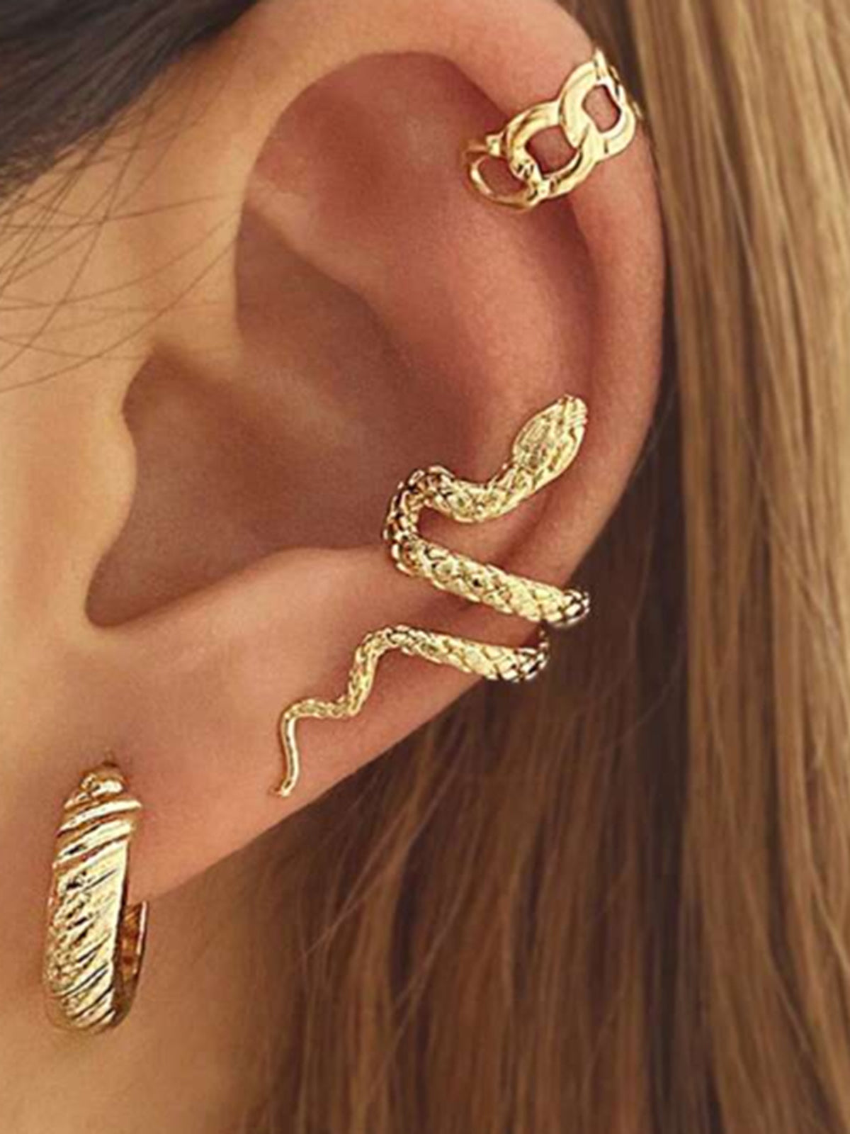 Boucle d'oreille unique en forme de serpent 